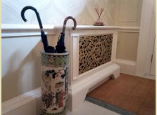 Radiator cover with bespoke brass grille